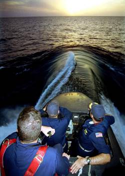 The commanding officer of the attack submarine USS City of Corpus Cristi (SSN 705), along with his navigator and lookout, guides his ship out to the Caribbean Sea from St. Croix in the U.S. Virgin Islands. July 29, 1999